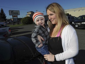 Jennifer Rowse with her 11-month-old son Josiah Rowse in Langley, BC Saturday, February 21, 2015. Rowse's breast milk is in demand by bodybuilders, among others.