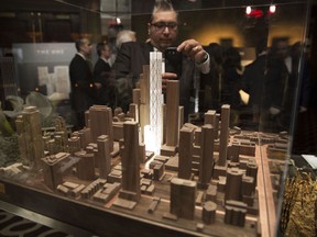 A design is presented during a community consulting meeting by Mizrahi Developments about a proposal for the construction of an 80-storey mixed-use building at the southwest corner of Yonge Street and Bloor Streets in Toronto, on Wed., March 11, 2015.