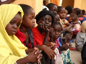 Girls rescued by Nigerian soldiers from Islamist militants Boko Haram at Sambisa Forest sit at the Malkohi refugee camp in Yola on May 5, 2015.