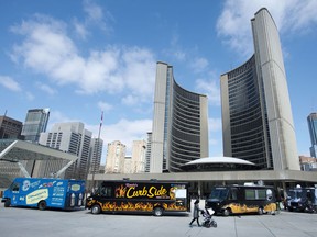 Food trucks line Nathan Phillips Square for a rally in front of City Hall in Toronto on April 2, 2014.