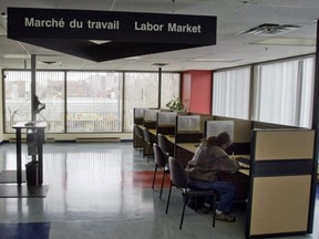 A man looks through jobs at a Resource Canada offices in Montreal.