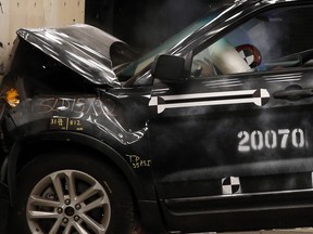 A crash test dummy's head hits the airbag in a Ford Motor Co. 2014 Explorer XLT during a head on 30 mile per hour crash test at the company's Crash Barrier Facility and Safety Laboratory at Ford's Proving Grounds in Dearborn, Michigan, U.S., on Monday, March 10, 2014. Ford, which recently completed it's 20,000 crash test at the Dearborn facility, is increasing its investment in computing power by fifty percent in order to conduct crash tests and retrieve data from them more quickly. Photographer: Jeff Kowalsky/Bloomberg