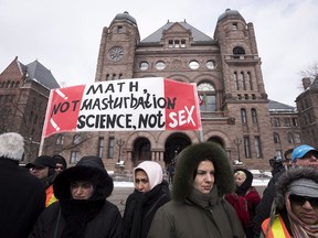 Demonstrators gather in front of Queen's Park to protest against Ontario's new sex education curriculum in Toronto on Tuesday, February 24, 2015.