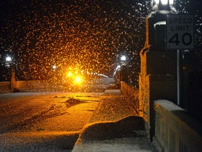 A swarm of mayflies hovers over the Route 462 bridge over the Susquehanna River late Saturday evening between Columbia and Wrightsville, Pa.