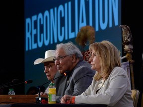 Commission chairman Justice Murray Sinclair, centre, and fellow commissioners Marie Wilson, right, and Wilton Littlechild discuss the commission's report on Canada's residential school system at the Truth and Reconciliation Commission in Ottawa on June 2, 2015.