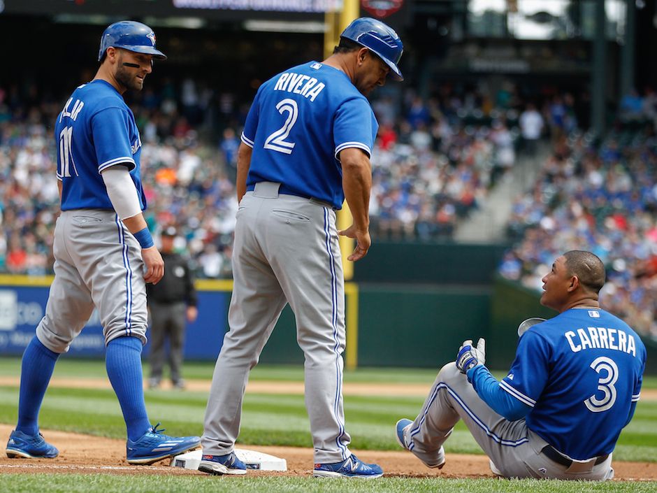 The Toronto Blue Jays' Jose Reyes is tagged out at home by Texas