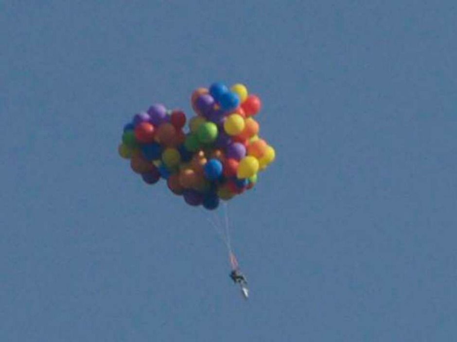 At cloud level: Man who floated over Calgary Stampede in chair ...