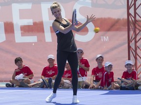 Eugenie Bouchard plays tennis atop a barge. She was joined by fellow Canadian Milos Raonic and kids from a local tennis club.