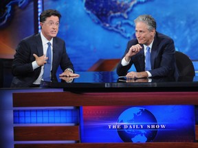 NEW YORK, NY - AUGUST 06: Stephen Colbert and Jon Stewart appear on "The Daily Show with Jon Stewart" #JonVoyage on August 6, 2015 in New York City.  (Photo by Brad Barket/Getty Images for Comedy Central)