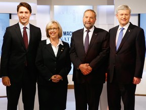 Canada's Liberal leader Justin Trudeau (L), Green Party leader Elizabeth May (2nd L), New Democratic Party (NDP) leader Thomas Mulcair and Conservative Prime Minister Stephen Harper (R)  pose ahead of the Maclean's National Leaders debate in Toronto, August 6, 2015.