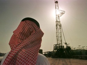 FOR USE WITH FEATURE PACKAGE FOR WEDNESDAY, APRIL 16--Khaled al Otaiby, an official of the Saudi oil company Aramco, watches progress at a rig at the al-Howta oil field near Howta, Saudi Arabia, on Feb. 26, 1997. Energy is the big strand in a web of U.S.-Saudi economic ties that has grown in the six years since an American-led army rolled back Iraqi aggression in the Persian Gulf.(AP Photo/John Moore)