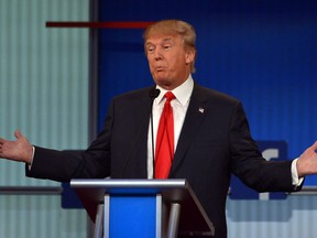 Real estate tycoon Donald Trump participates in the first Republican presidential primary debate on August 6, 2015 at the Quicken Loans Arena in Cleveland, Ohio. AFP PHOTO / MANDEL NGAN ORG XMIT: 125