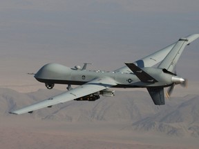 In this undated handout file photo provided by the U.S. Air Force, a MQ-9 Reaper, armed with GBU-12 Paveway II laser guided munitions and AGM-114 Hellfire missiles is seen flying over Afghanistan