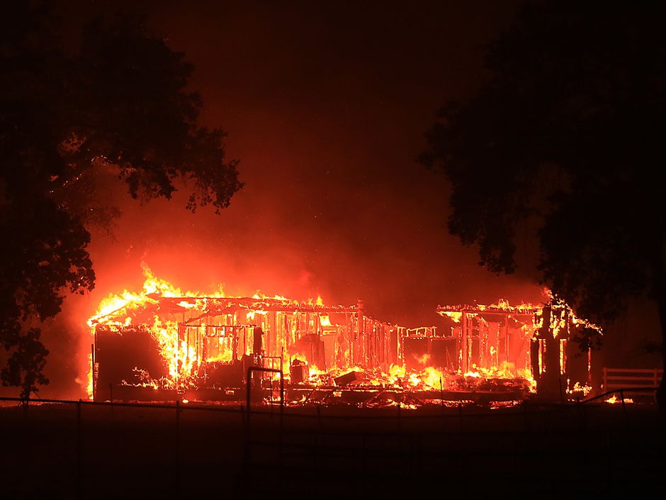 Wildfires rip through Northern California, destroying more than