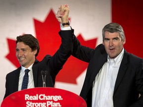 Justin Trudeau stands on stage with Nova Scotia Premier Stephen McNeil  at a campaign rally in Enfield, N.S., on Sunday, Sept. 20, 2015.