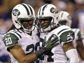 New York Jets cornerback Darrelle Revis, right,  celebrates a fumble recovery with cornerback Marcus Williams during the second half against the Indianapolis Colts in Indianapolis Monday. The Jets won 20-7. AP Photo/Darron Cummings