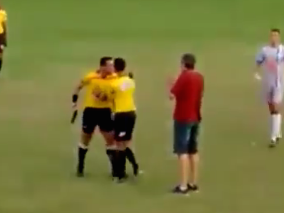 Referee pulls out a gun after getting kicked and punched by player during soccer game in Brazil