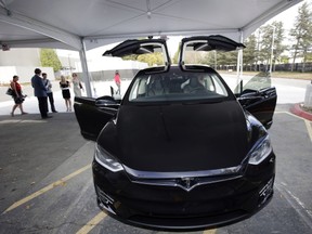 The Tesla Model X car is introduced at the company's headquarters Tuesday, Sept. 29, 2015, in Fremont, Calif. Tesla's Model X  one of the only all-electric SUVs on the market  was officially unveiled Tuesday night near the company's California factory. (AP Photo/Marcio Jose Sanchez)