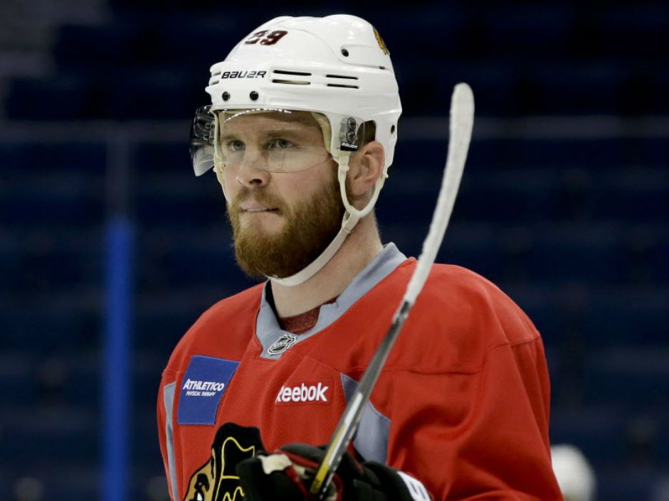 Hawks' Keith happily trades teeth for Cup berth