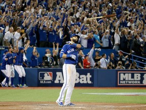 Jose Bautista flips his bat after hitting a three-run home run in the seventh inning of Game 5 of the 2015 ALDS against the Texas Rangers.