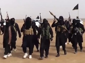 An image grab taken from a propaganda video uploaded on in 2014 by ISIL showing militants gathering at an undisclosed location in Iraq's Nineveh province.
