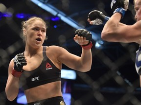 Ronda Rousey (left) fights Holly Holm during UFC 193 on Nov. 15, 2015.