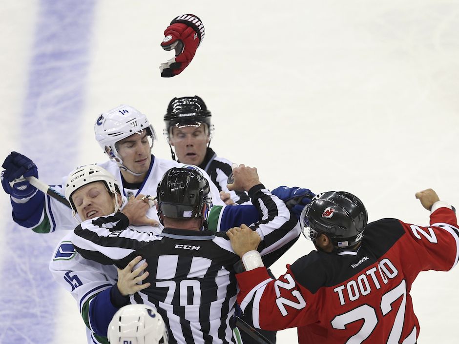 Alex Burrows waves to fans after him and his family drop the puck at  News Photo - Getty Images