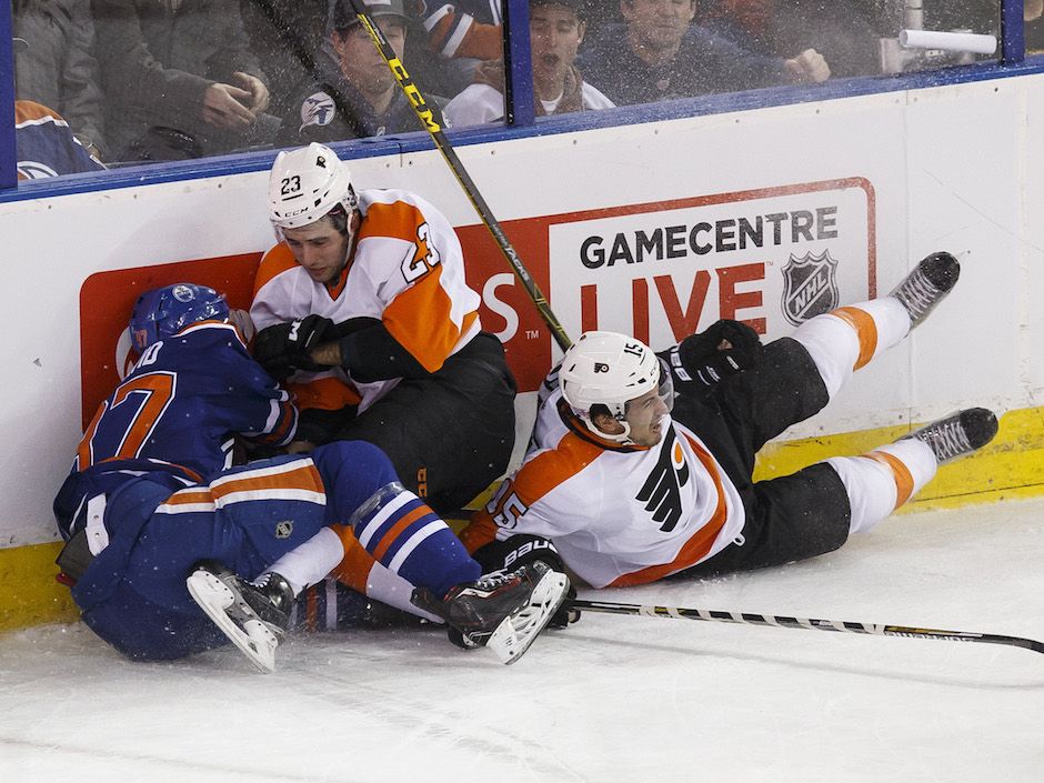 Oilers forward Matt Hendricks shows off shattered cup after taking