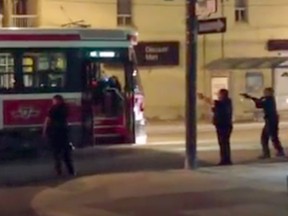 Const. James Forcillo, second from right, with gun drawn confronts Sammy Yatim, visible in first window, on a Toronto streetcar in July 2013.