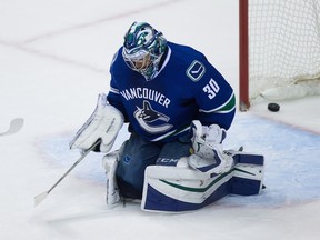 Markus Naslund of the Vancouver Canucks looks on against the