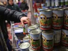 Harlem residents pick up free groceries at the Food Bank For New York City in 2013.