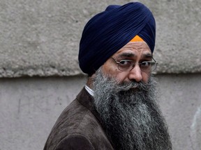 Inderjit Singh Reyat waits outside B.C. Supreme Court in Vancouver on Sept. 10, 2010.