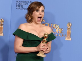 Rachel Bloom poses in the press room with the award for best actress in a TV series, comedy or musical, for her role in "Crazy Ex-Girlfriend" at the 73rd annual Golden Globe Awards on Sunday, Jan. 10, 2016, at the Beverly Hilton Hotel in Beverly Hills, Calif. (Photo by Jordan Strauss/Invision/AP)