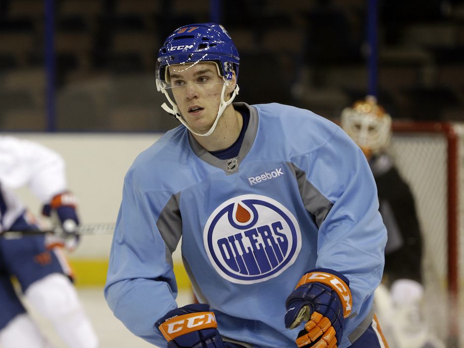 Oilers forward Matt Hendricks shows off shattered cup after taking