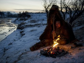 Hugh Glass (Leonardo DiCaprio) struggles to stay warm during a vicious winter.