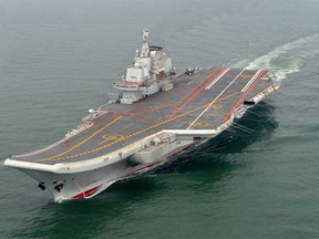 FILE - This May 2012 file photo provided by China's Xinhua News Agency shows the Chinese aircraft carrier Liaoning cruising for a test on the sea. A congressional advisory panel sounded a warning Wednesday about China's military buildup, predicting Beijing could possess the largest fleet of modern submarine and combatant ships in the western Pacific by 2020. The U.S.-China Economic and Security Review Commission said China's military modernization is altering the balance of power in the Asia-Pacific region and challenging decades of U.S. pre-eminence. (AP Photo/Xinhua, Li Tang, File) NO SALES