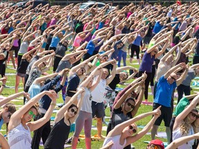 Yoga enthusuasists take a class on Parliament Hill  in June.