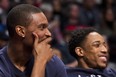 Miami Heat's Chris Bosh, left, laughs with former teammate Toronto Raptors' DeMar DeRozan (on the Eastern Conference bench) during first half of NBA All-Star Game in Toronto on Sunday.