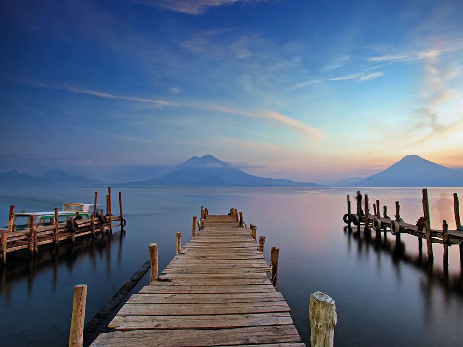 Walking along Guatemala's Lake Atitlan: Looming volcanoes surround ...