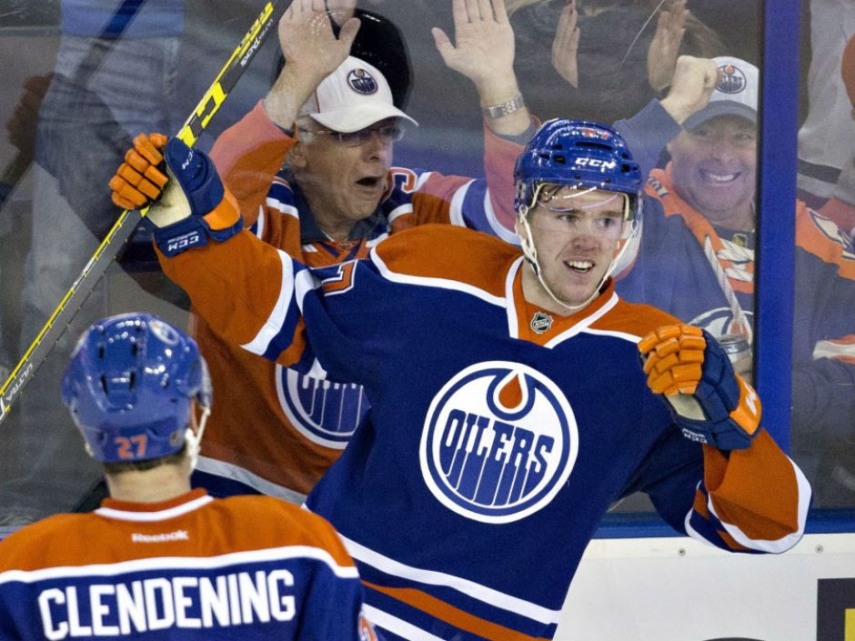 Oilers forward Matt Hendricks shows off shattered cup after taking