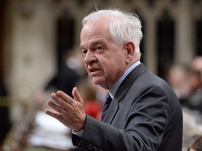 John McCallum, the Minister of Immigration, Refugees and Citizenship, announcing last year the Liberal government's plans to repeal a controversial section of Bill C-24.