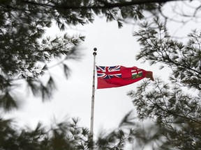 The Ontario flag flying at Queen's Park, the seat of the Ontario legislature,.
