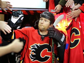 Calgary Flames defenceman Dennis Wideman was suspended for knocking down NHL linesman Don Henderson during a game against the Nashville Predators.