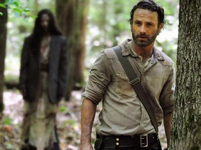 Andrew Lincoln plays Rick Grimes in a scene from the season four of "The Walking Dead."