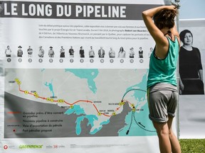 Melissa Lachance of Montreal, looks at a map of the proposed Energy East pipeline.