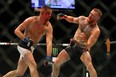 Nate Diaz punches Conor McGregor during UFC 196 at the MGM Grand Garden Arena.