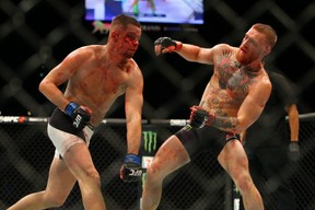 Nate Diaz punches Conor McGregor during UFC 196 at the MGM Grand Garden Arena.