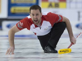 In this March 13, 2016 file photo, Newfoundland and Labrador skip Brad Gushue reacts as his shot enters the house during the Brier gold medal game against Alberta in Ottawa.