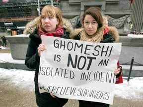 Protesters in front of Toronto's Old City Hall courthouse Thursday March 24, where Jian Ghomeshi's sexual assault trial took place.