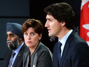 Prime Minister Justin Trudeau, along with Minister of National Defence Harjit Sajjan and Minister of International Development Marie-Claude Bibeau.